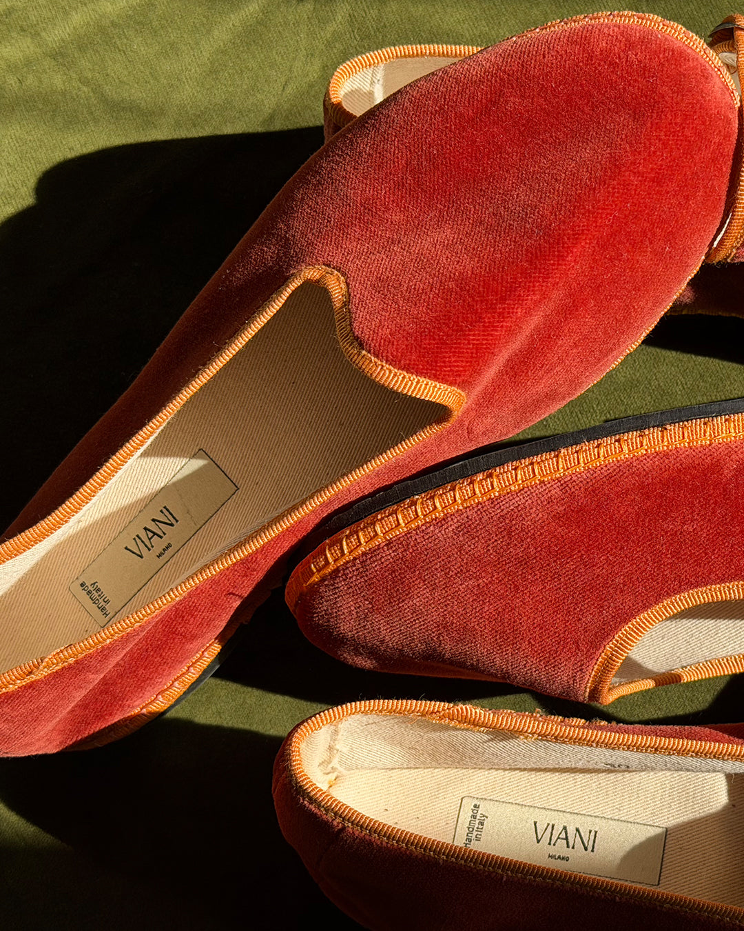 Pair of Ambra Friulane in terracotta velvet with amber trim and handmade in Italy label