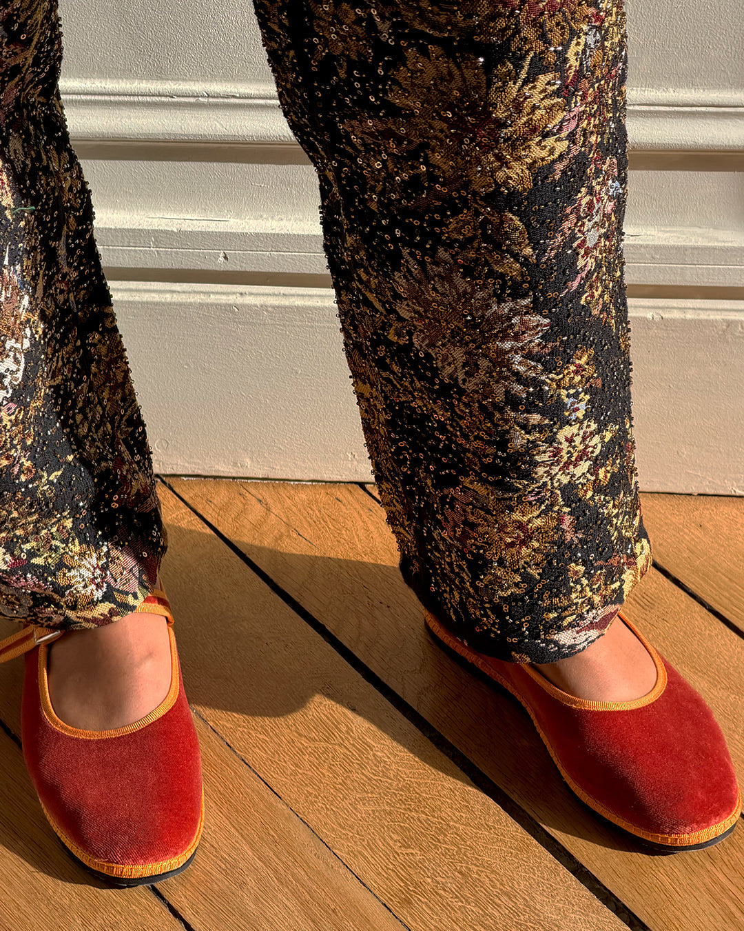Tamu Mary Jane Friulane in terracotta velvet with clementine orange trim with printed trousers.